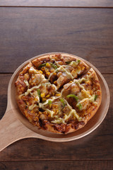 Delicious tasty pizza with on wooden table