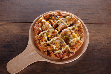 Delicious tasty pizza with on wooden table
