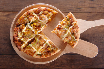 Delicious tasty pizza with on wooden table