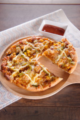 Delicious tasty pizza with on wooden table