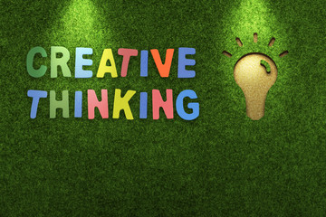 Colorful text of &ldquo;Creative Thinking&rdquo; with green grass background