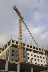 Building and Construction Concepts. Construction Building Site With Industrial Mid-Size Crane.