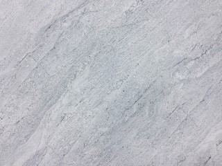 Texture and background of grey granite stone