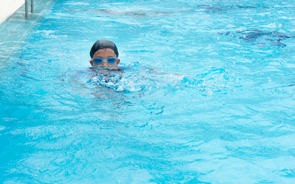 Asian Boy Practice Swimming.