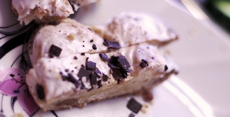 Eclair cakes with chocolate topping on a white plate