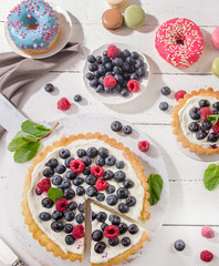 Sweet desserts with fresh berries. Top view