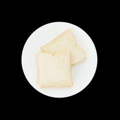 Closeup two slice bread on white dish for breakfast with shadow isolated on black background