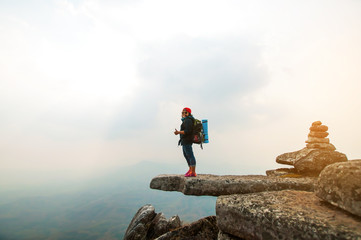 Obraz premium happy woman smile on top mountain with blue sky at sunny day, subject is soft focus