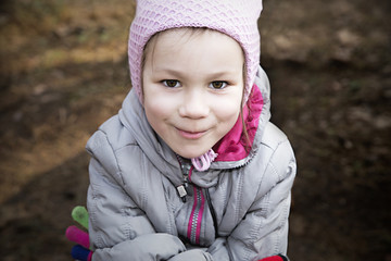 little girl looks at camera