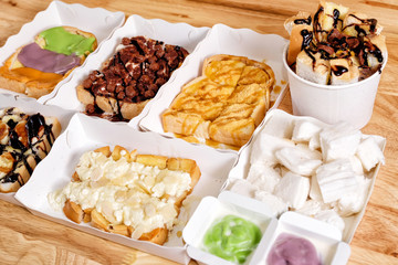 Dessert time with Thai colorful custard Toast, Chocolate Toast, Butter Toast with caramel, Butter Toast with Whipped Cream and Steamed bread with Thai coconut custard dips