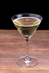 white wine glasses on wooden table.