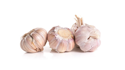 Fresh organic garlic, cloves and cutted garlic clove isolated on white background.