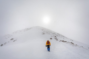 Tourist in the snowy mountains