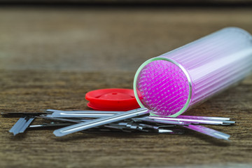 Close up  capillary tube with blood lancet , Medical equipment on wooden  background,selective focus.