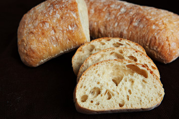 Fresh sliced italian Ciabatta bread on background