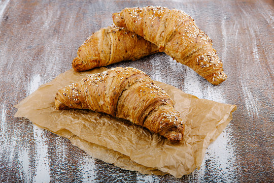 Tasty buttery croissants on bacground from wholemeal flour