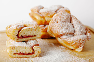 baked pastry with jam filling on table background, homemade bakery