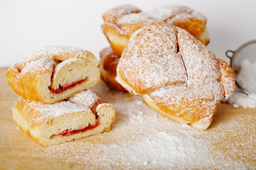 baked pastry with jam filling on table background, homemade bakery