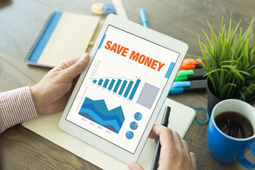 Business Charts and Graphs on screen with SAVE MONEY title