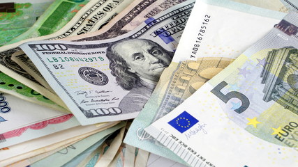 US dollars, Korean Won, Euro bills and some money bills and banknotes. Currency foreign exchange. Business and Financial or money management for investments.