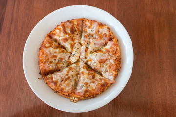 close-up,Delicious Pizza with Ham, Bacon and sausages