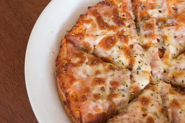 close-up,Delicious Pizza with Ham, Bacon and sausages