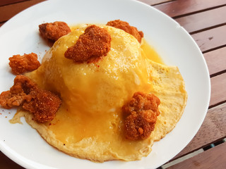 Close-up,Thai food style:scrambled omlette eggs with spicy chicken on rice