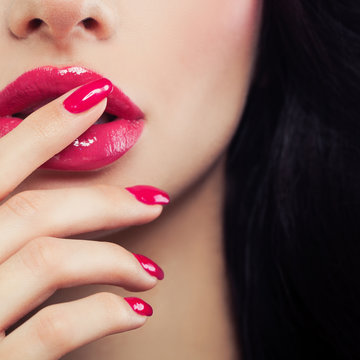 Pink Female Lips and Manicure Hand Close up. Lip Gloss Makeup, Beauty Background