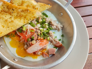 Breakfast thai food style:Close-up,pan-fried egg with pork and toppings