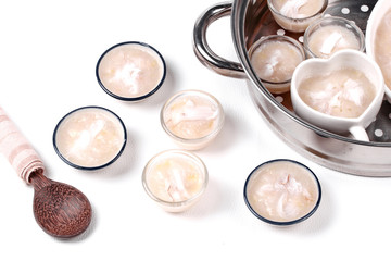 Streamed sweet banana dessert topped coconut roll .