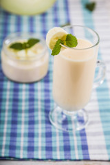 Yogurt and smoothie with melon. Delicious dairy dessert for breakfast.