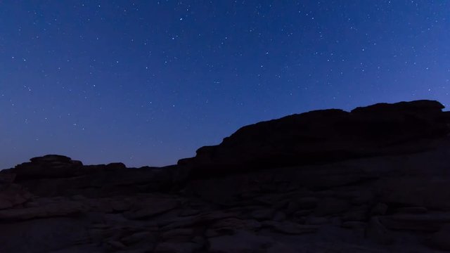 Time-lapse of star trails on stone mountain