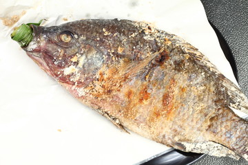 Salt baked mango fish represent the thai cuisine and food concept related idea. 