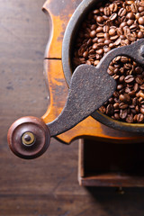 close-up of old coffee grinder and roasted coffee beans