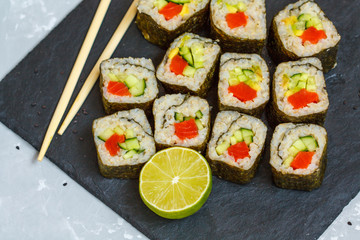 Healthy homemade sushi rolls with brown rice and fish.