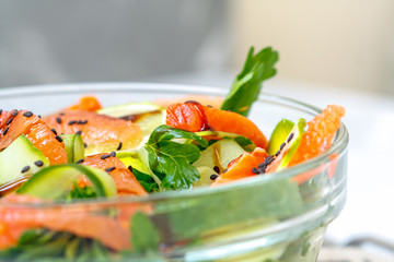Citrus green salad with salmon, grapefruit and avocado.
