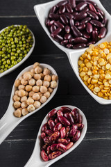 mix of beans on wooden table