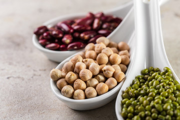 mix of beans on wooden table