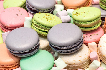 Fototapeta na wymiar Food background of colorful macaroons and marshmallow