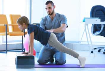Physiotherapist working with patient in clinic