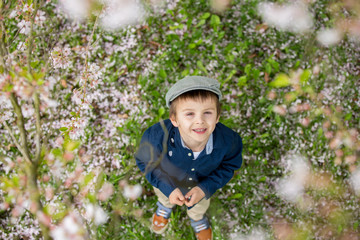 Beautiful portrait of a young preschool child holding flower