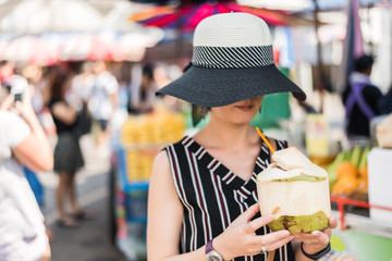woman hold a coconut