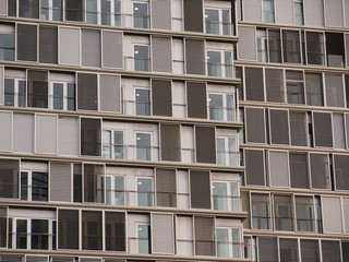 Facade of modern office building glass wall front view