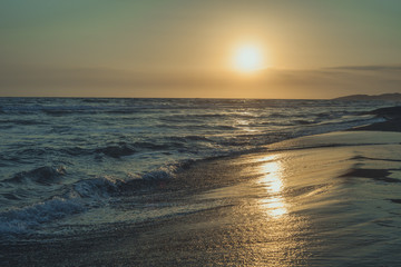  sunset at sand beach at sea