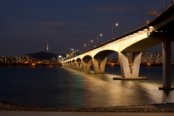 Wonhyo Bridge Over Han River and Namsan Tower Background at Night in Seoul, South Korea
