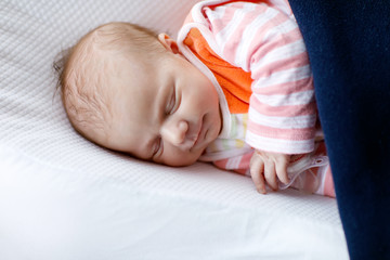 Portrait of cute adorable newborn baby girl sleeping