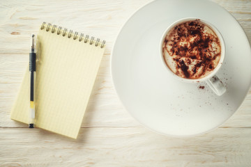 Sketchpad and a cup of hot cocoa