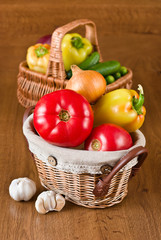 Fototapeta na wymiar Fresh vegetables and tomatoes in baskets