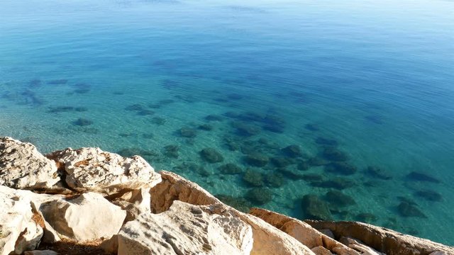 Crystal clear blue sea and rocky coastline in Croatia