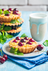 Small tarts with fresh cherries